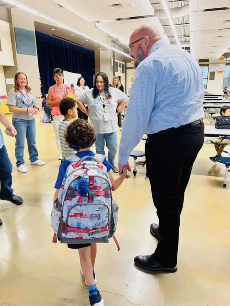 Principal walking student