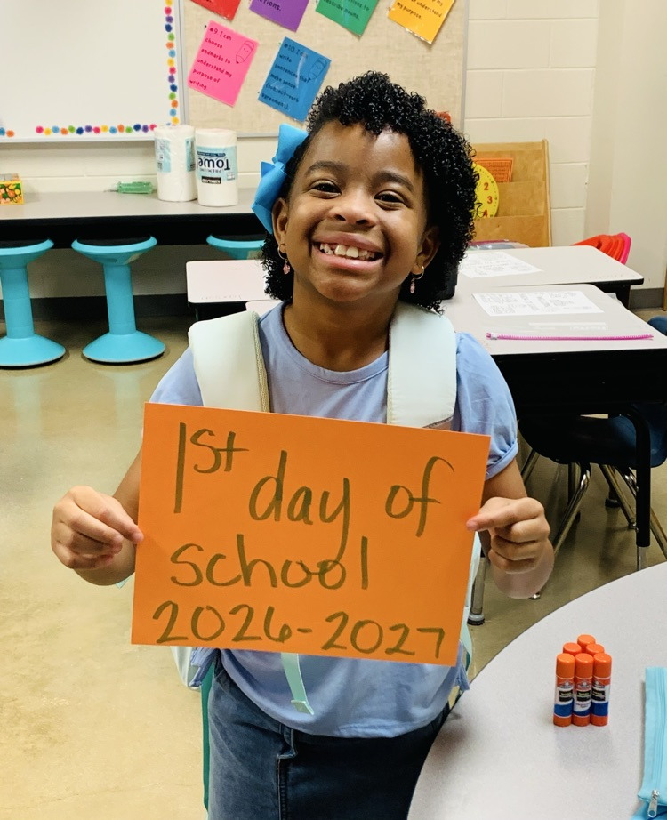 Student holding sign.
