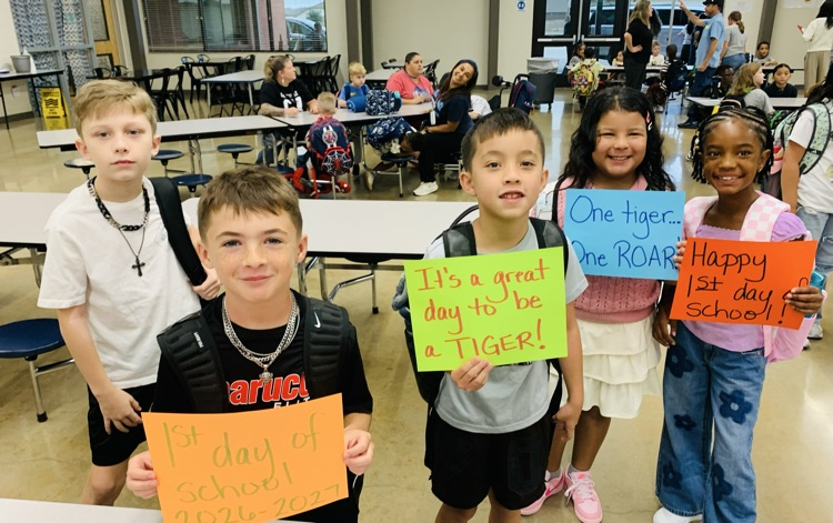 Students holding signs