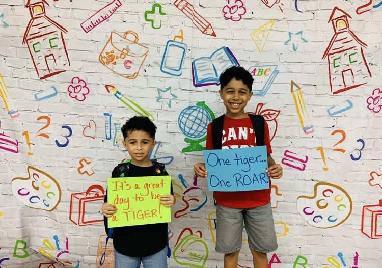Students holding signs