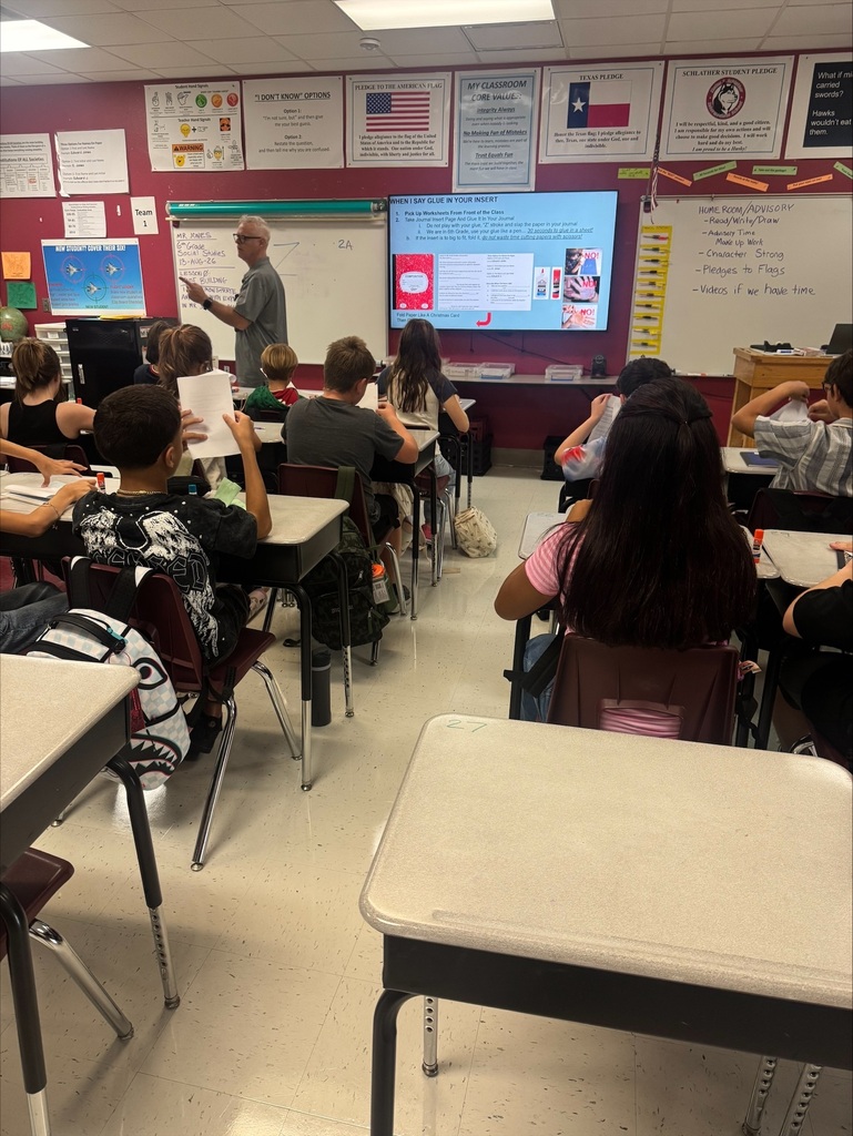 teacher engaging students in class discussion.