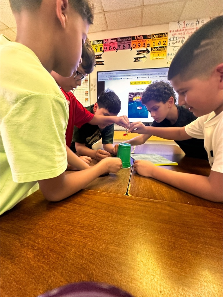 students working together on a team building activity in Ms Dixon's Math class