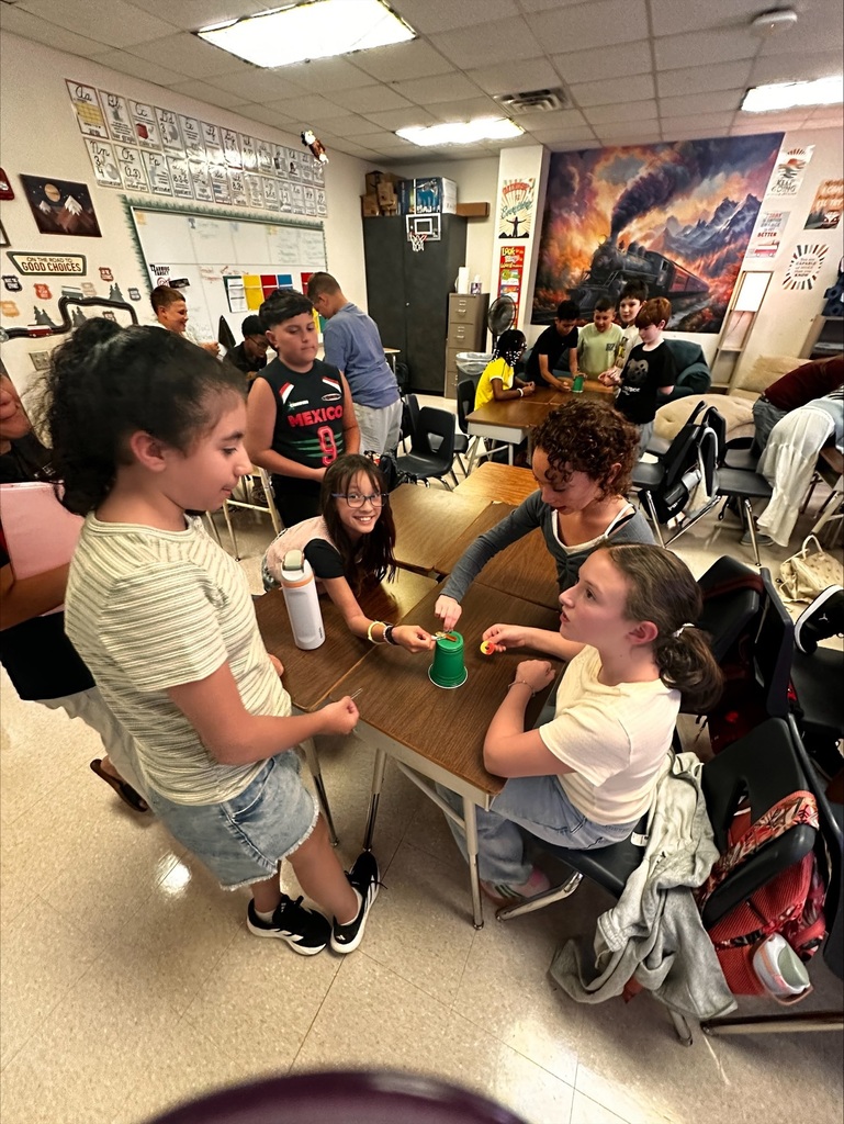 students working together on a team building activity in Ms Dixon's Math class
