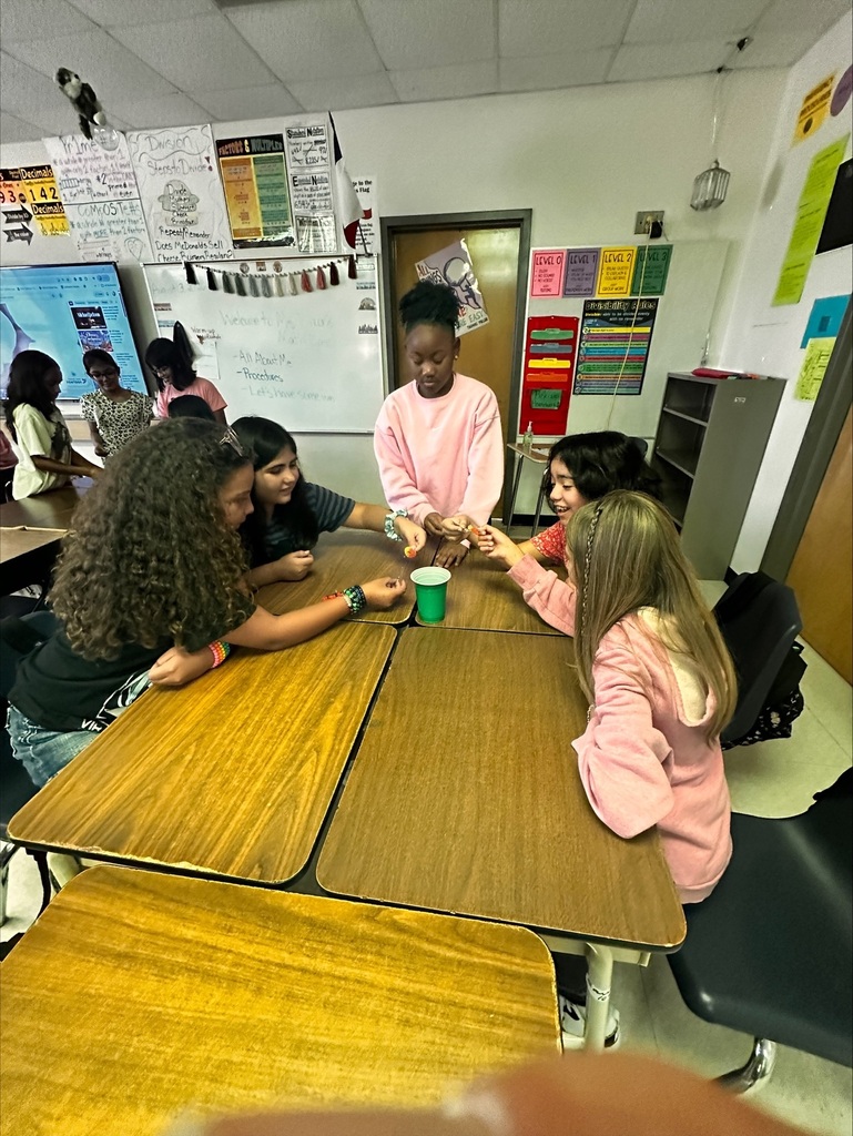 students working together on a team building activity in Ms Dixon's Math class