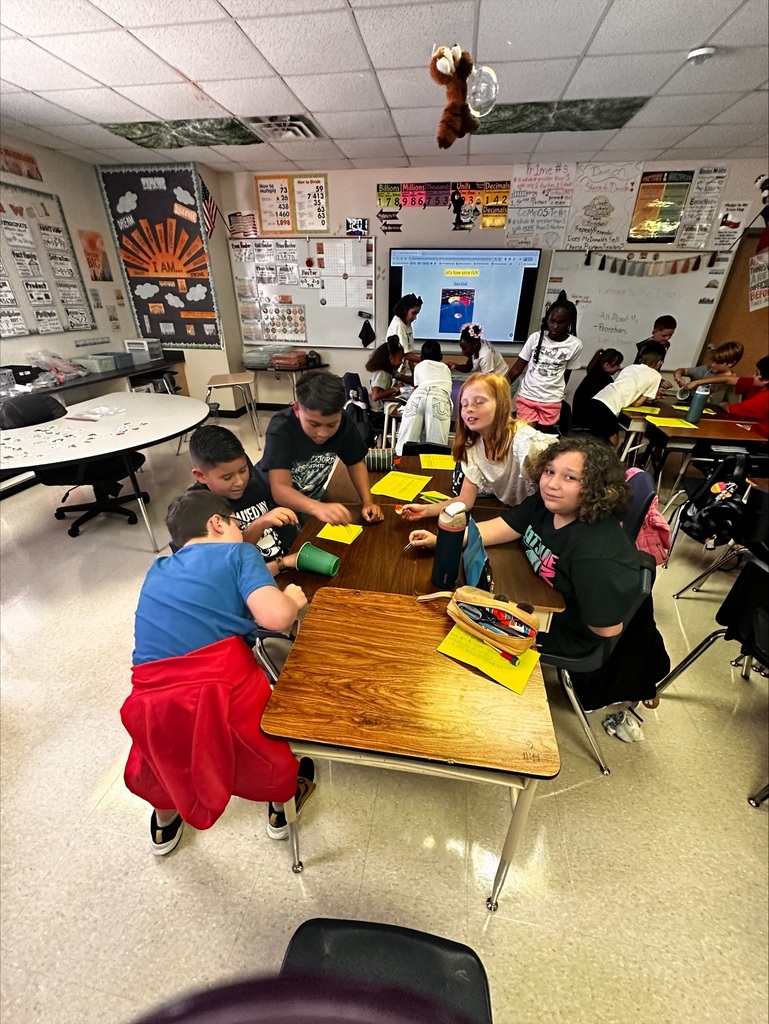 students working together on a team building activity in Ms Dixon's Math class