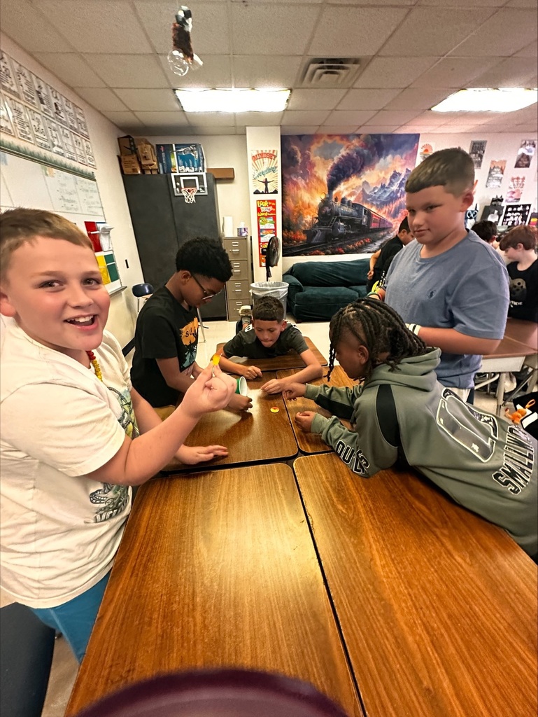 students working together on a team building activity in Ms Dixon's Math class