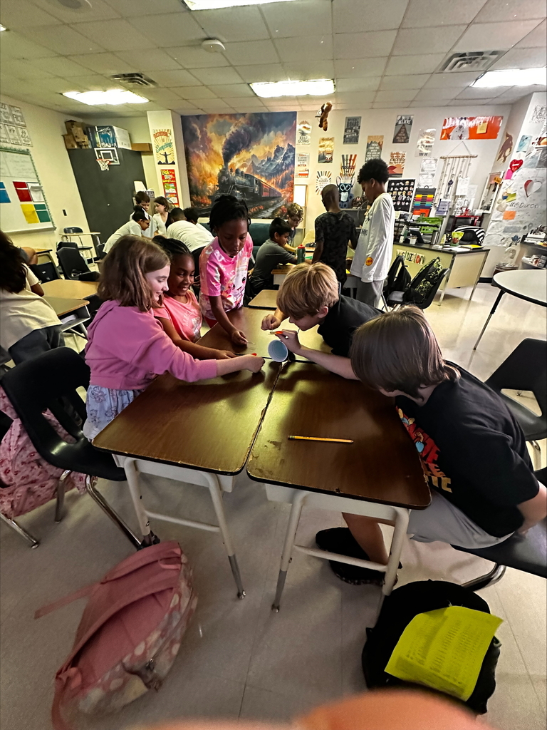 students working together on a team building activity in Ms Dixon's Math class