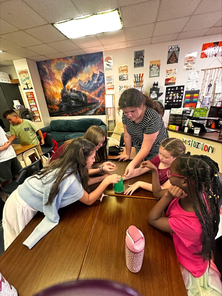 students working together on a team building activity in Ms Dixon's Math class
