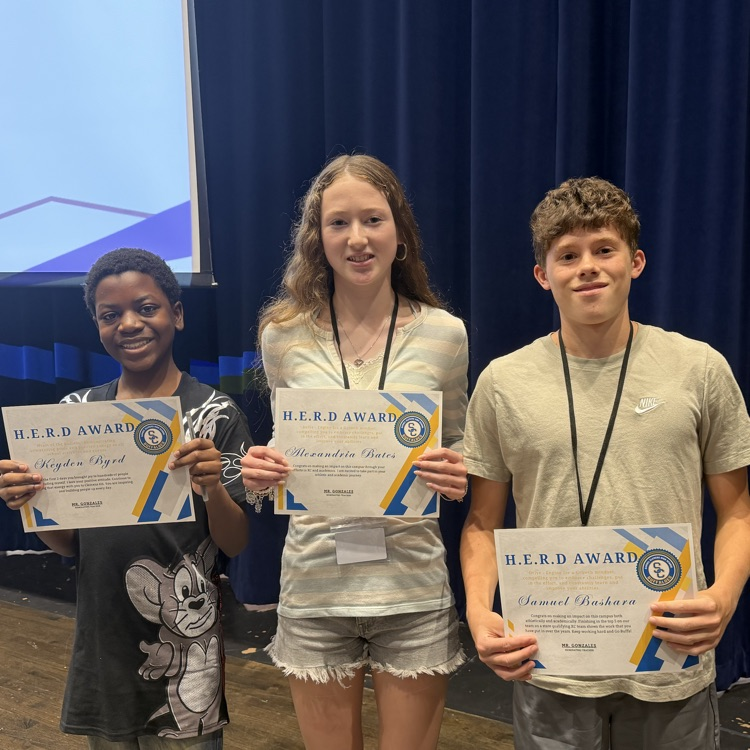 students holding a certificate