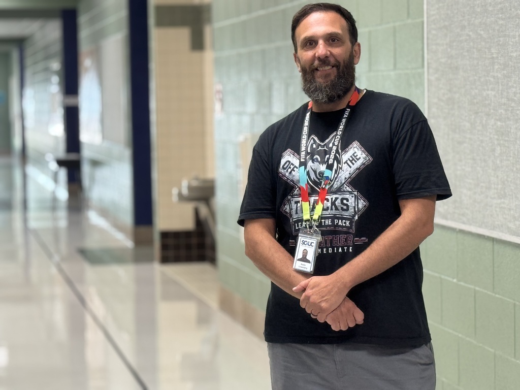 photo of teacher in hallway