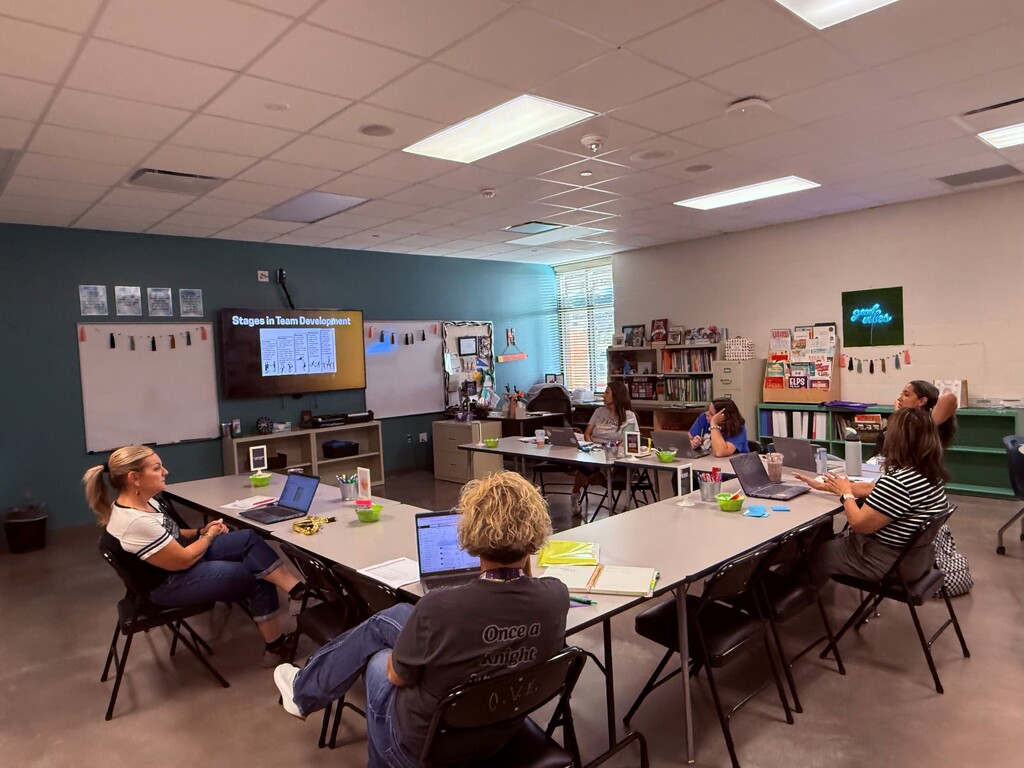 Teachers sitting around tables.