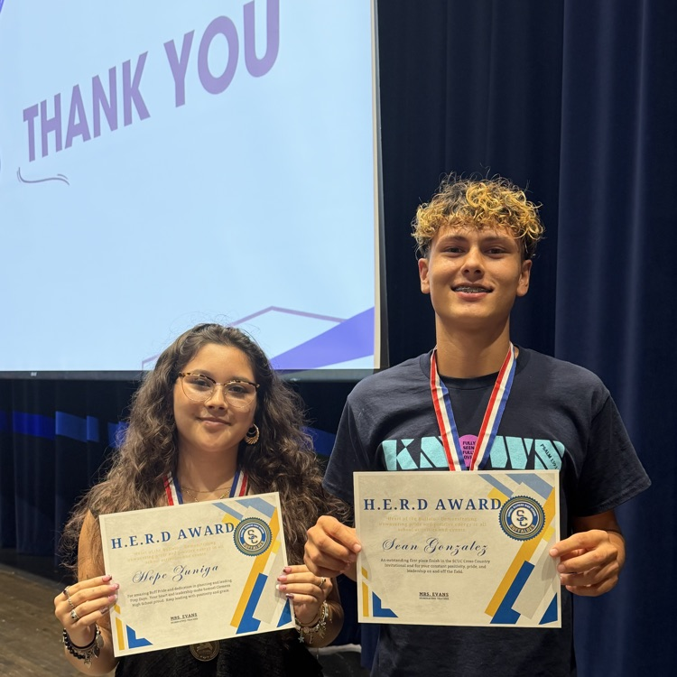 students holding certificates and smiling