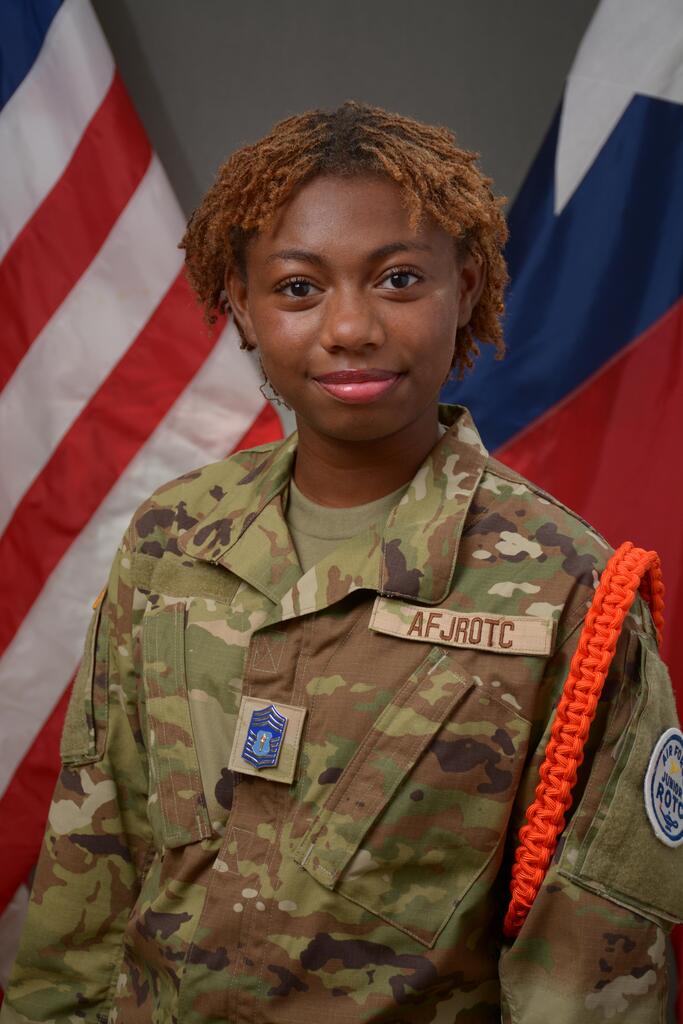 student smiling wearing AFJROTC camo