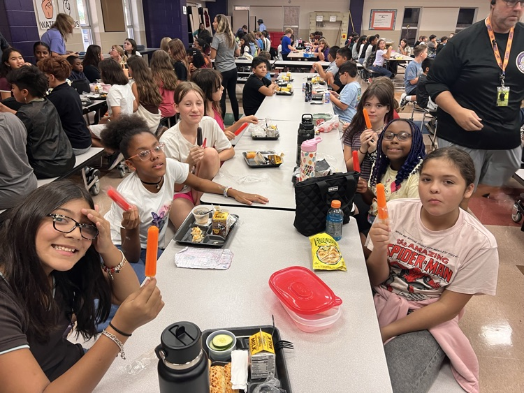 students in cafe with their popsicles 