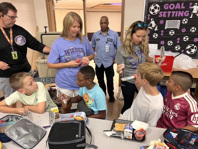 PTC handing out popsicles to students