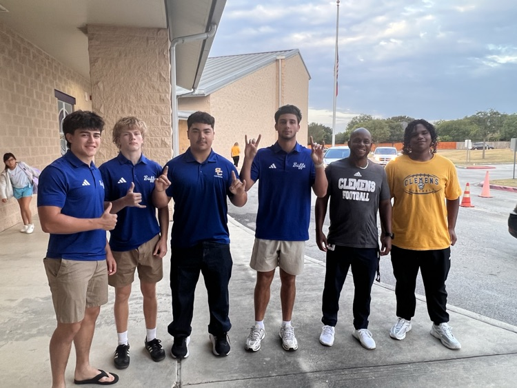 5 Clemens football players with their coach at wilder intermediate 