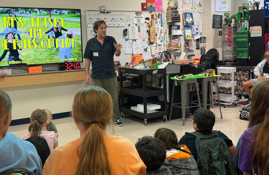 picture of author, James Kennedy, promoting an after school club for 6th graders