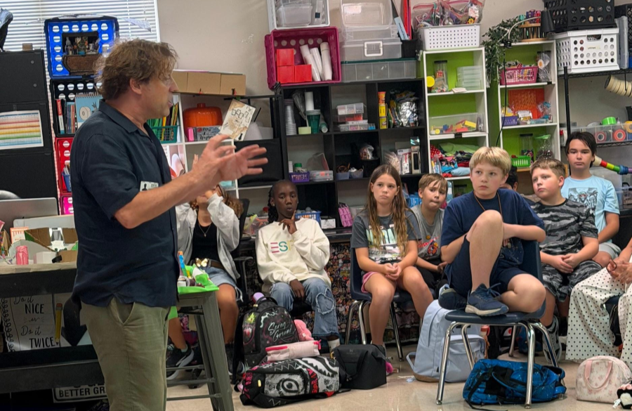 picture of author, James Kennedy, promoting an after school club for 6th graders
