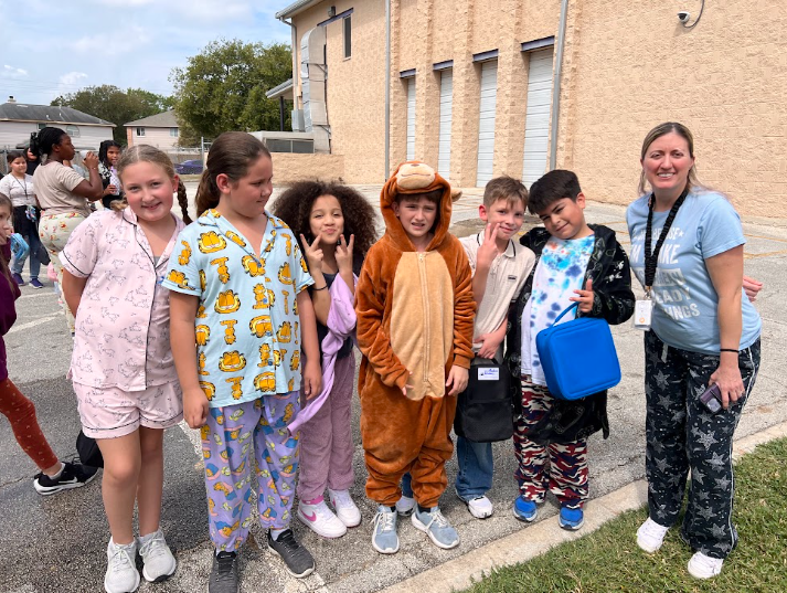 Ms. Moon's class in pajamas posing for the camera
