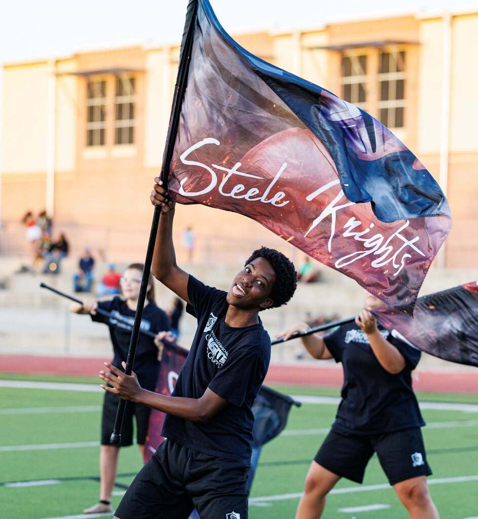 Student with steele knights flag