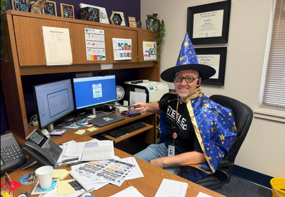 Mr. Jackson dressed as a wizard in his office