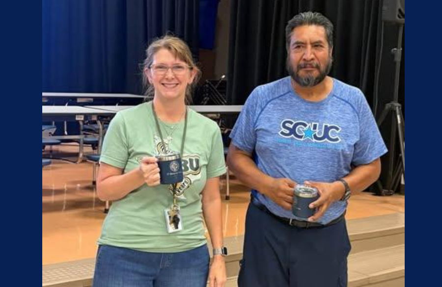 picture of teachers and staff holding their Years of Service award