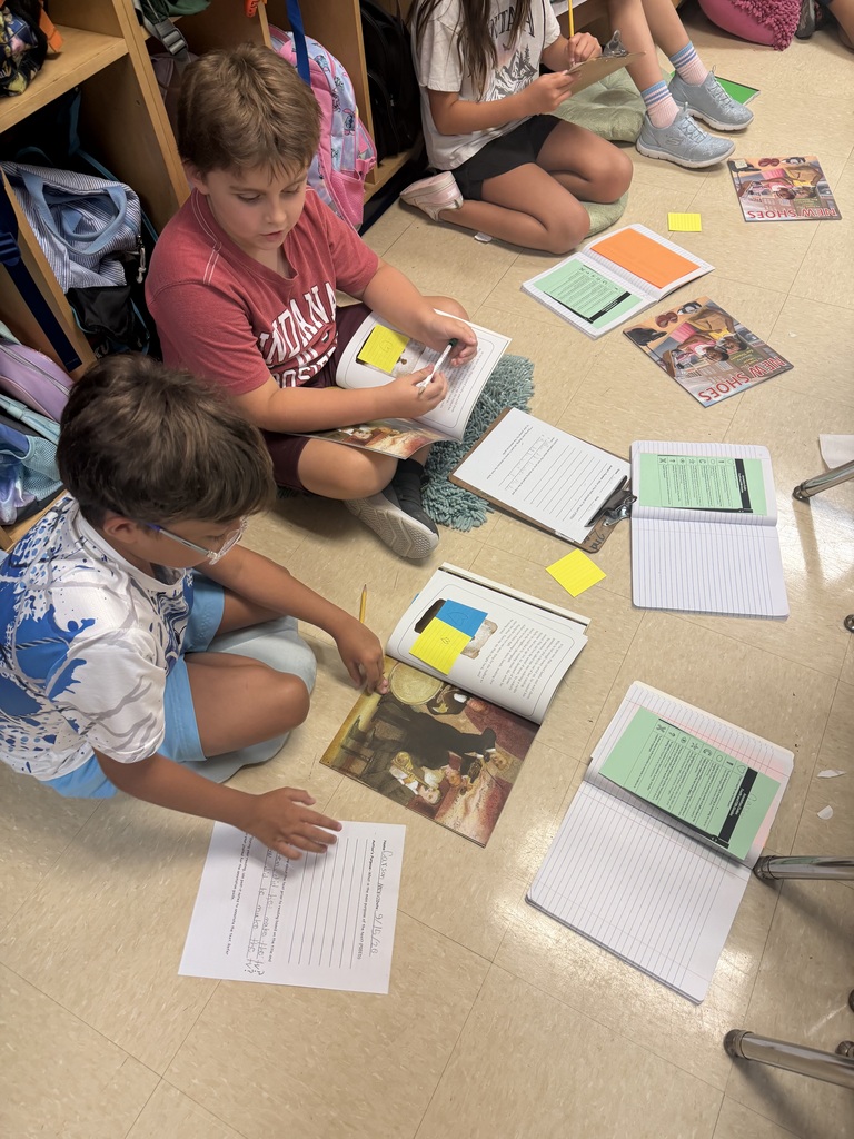 4th graders diving into reading.