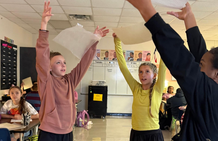 picture of students working on a science lab together