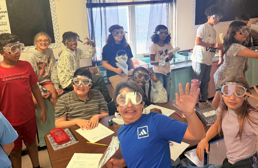 picture of students working on a science lab together