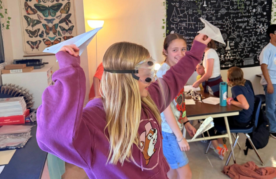 picture of students working on a science lab together