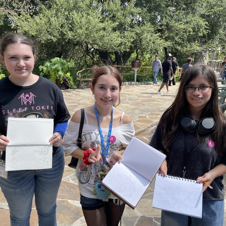 students showing artwork