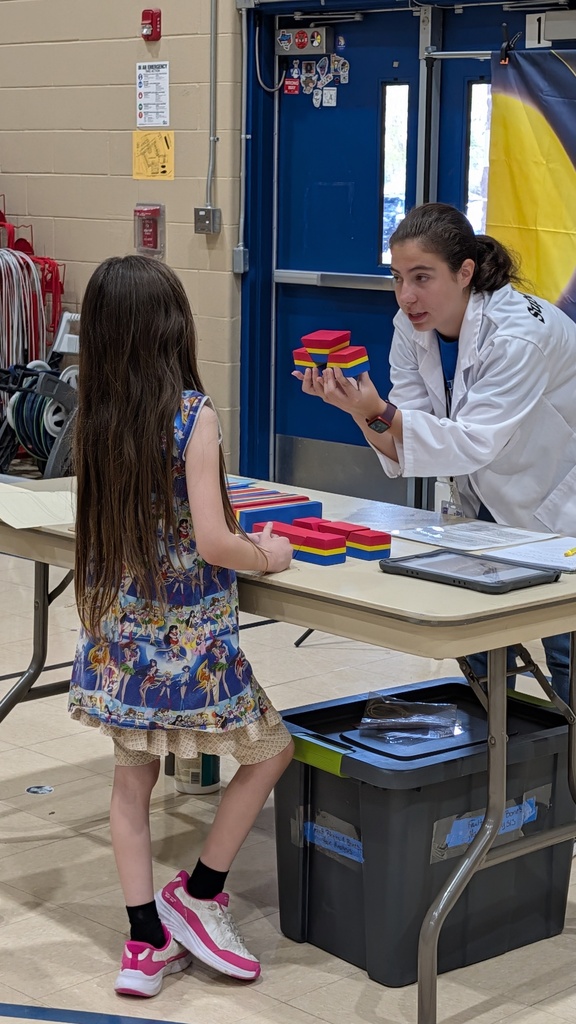 students explaining science experiment