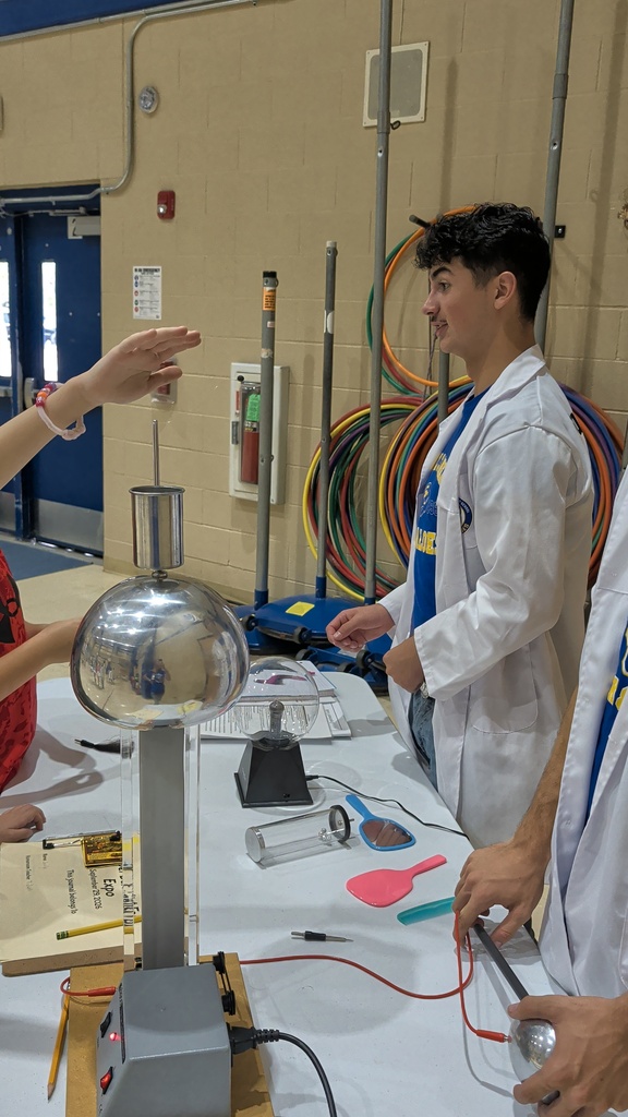 students looking at a science project