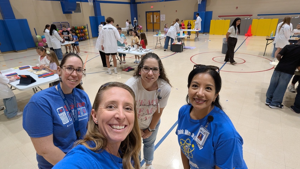 teachers smiling in a gym