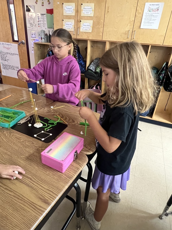 2nd graders creating new materials