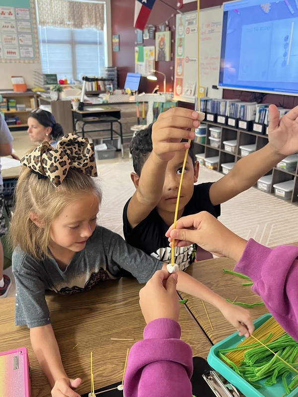 2nd graders creating new materials