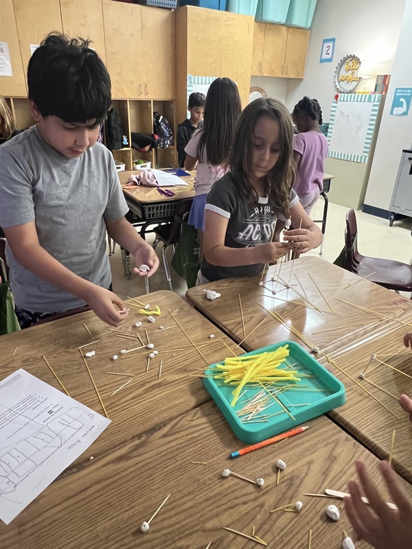 2nd graders creating new materials