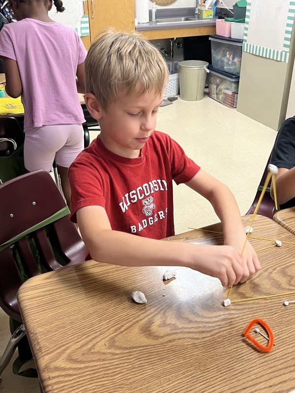 2nd graders creating new materials