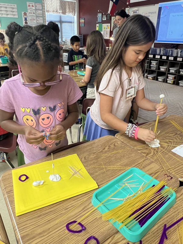 2nd graders creating new materials