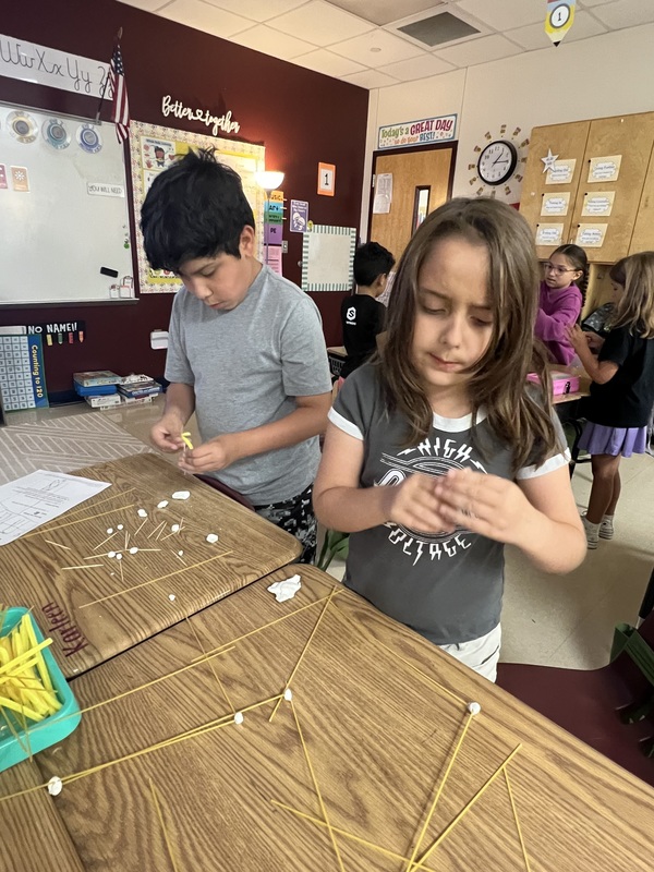 2nd graders creating new materials