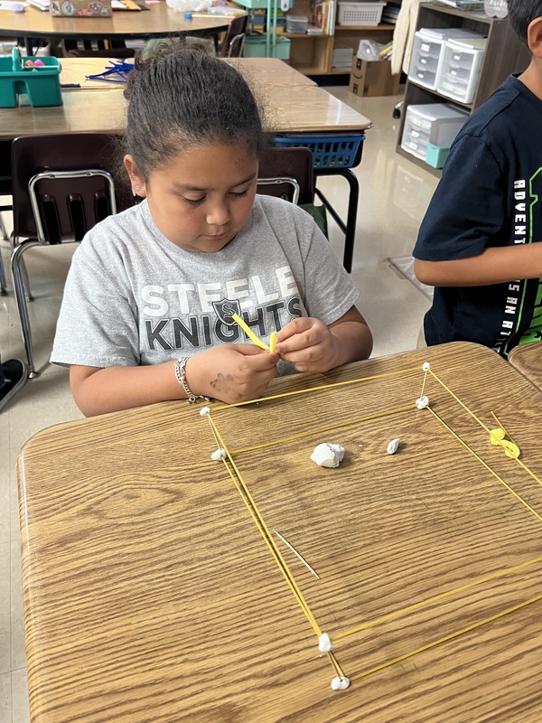 2nd graders creating new materials