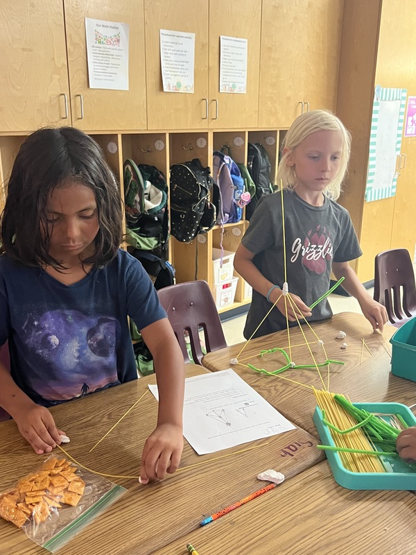 2nd graders creating new materials