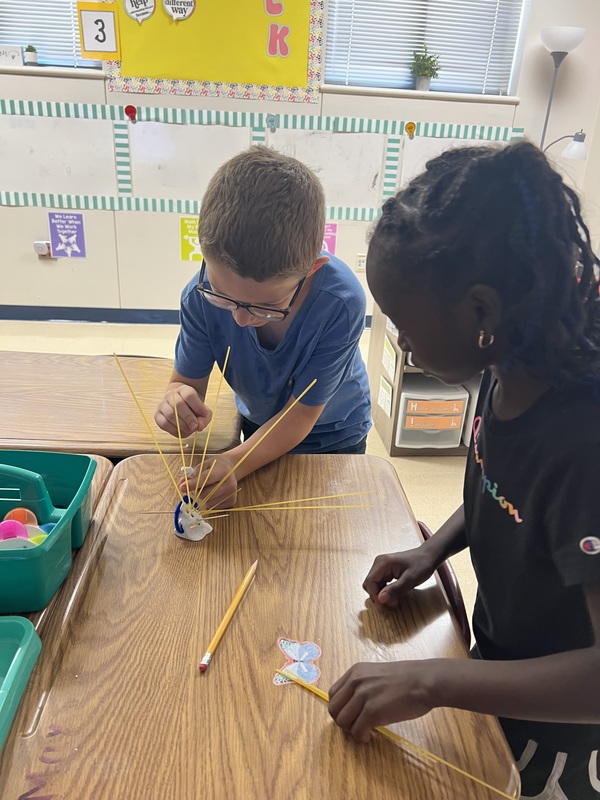 2nd graders creating new materials