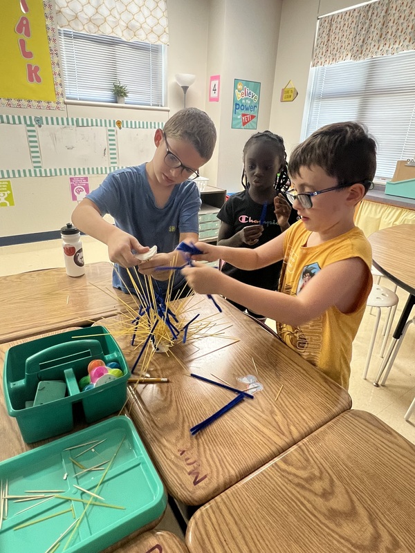 2nd graders creating new materials