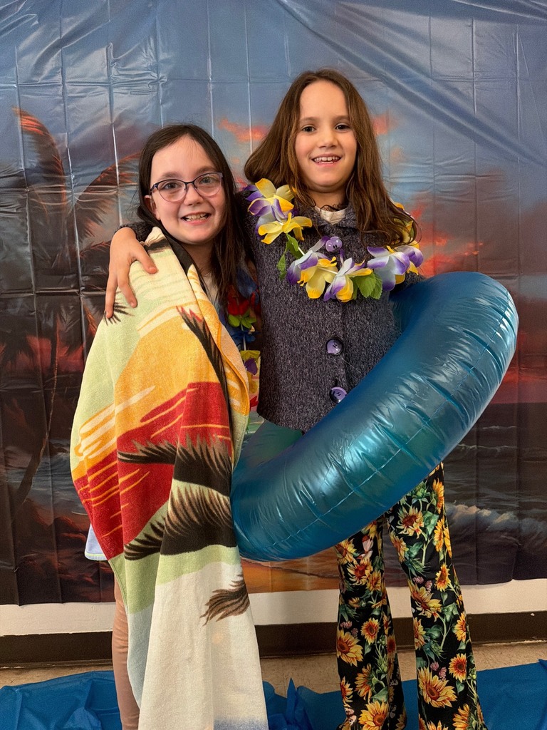 students posing at the beach