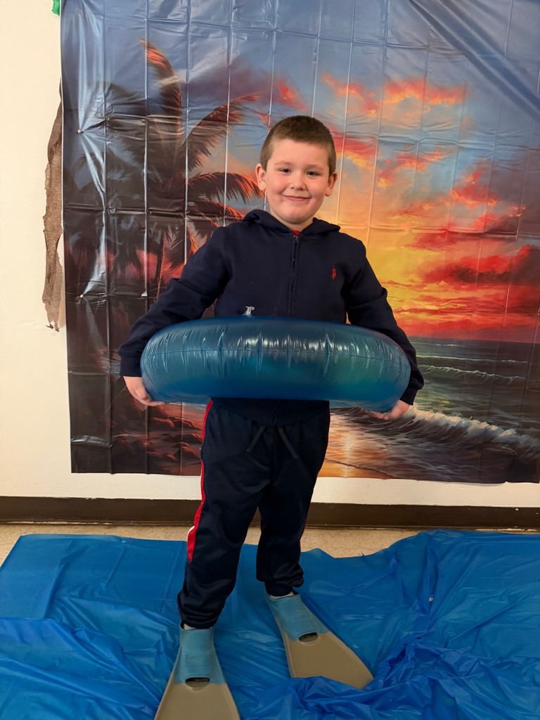 students posing at the beach