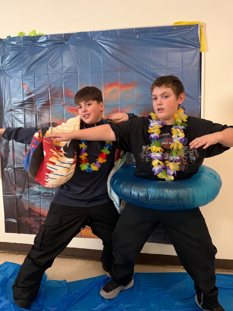 students posing at the beach