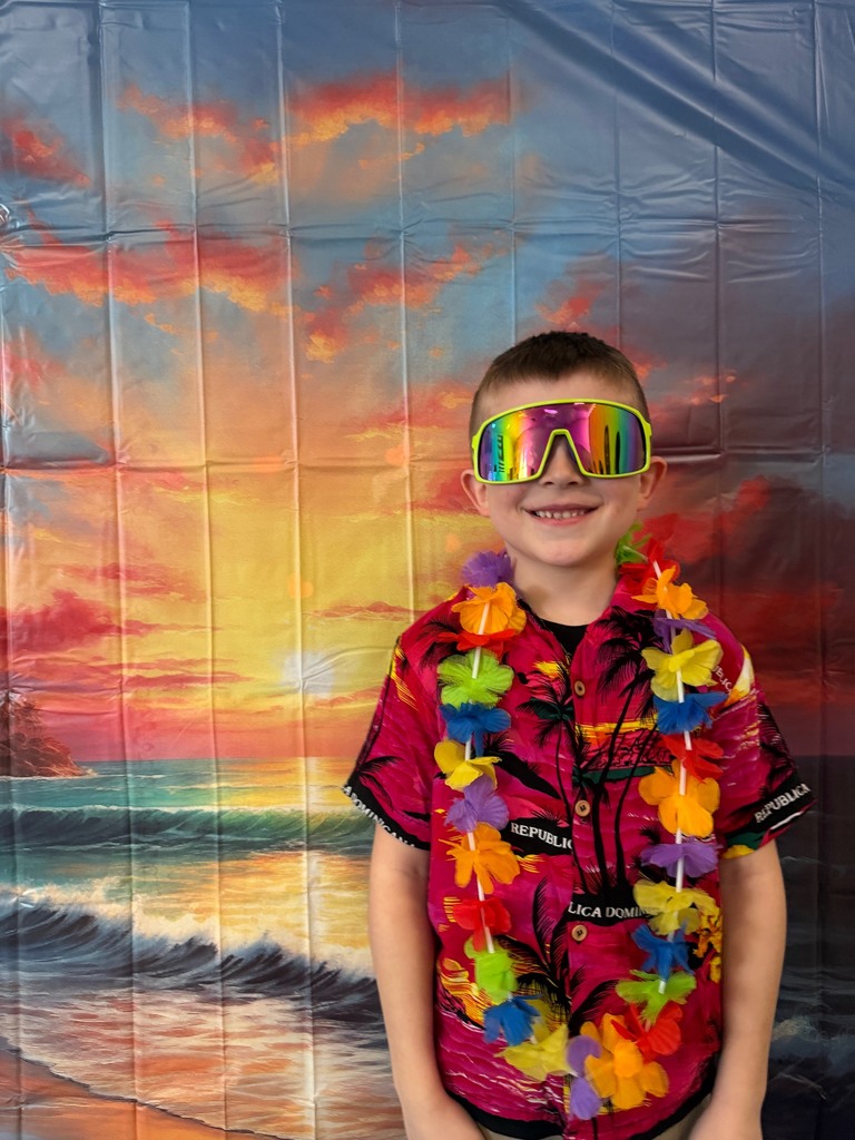 students posing at the beach