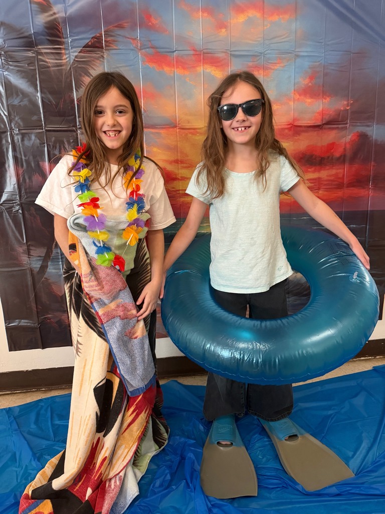 students posing at the beach