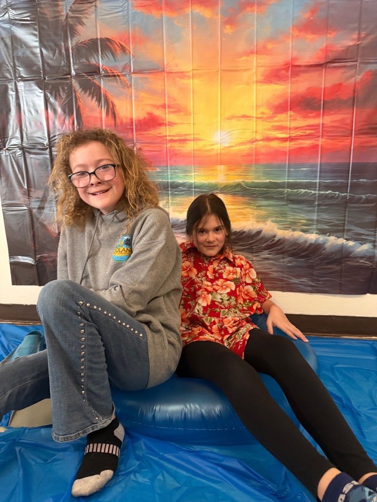 students posing at the beach